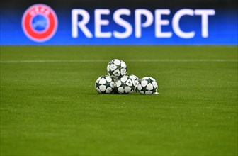 Match balls with Champions League Logo in front of UEFA perimeter advertisement