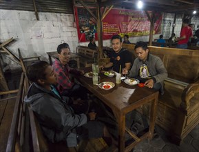 Locals eating Indonesian food