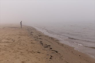 Lonely man on the beach at Mellbystrand