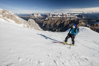 Ski mountaineer in ascent to Punta Rocca