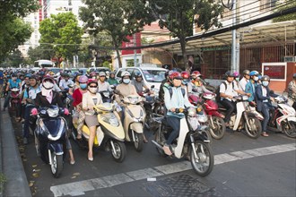 Many mopeds on the road