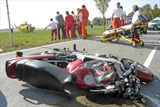 Wrecked motorcycle on road