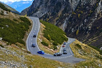 Cars on a mountain road in a hairpin curve