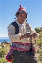 Native man knitting