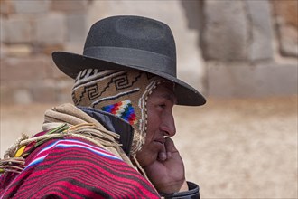 Indigenous man in typical national clothing with typical hat