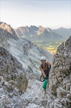 Hiker climbs the Santner via ferrata