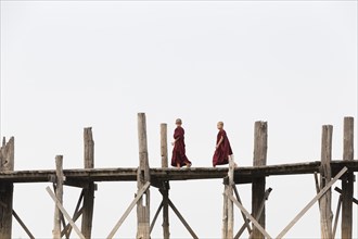 Monks crossing U Bein bridge