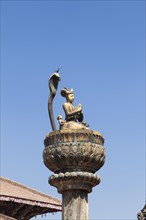 Statue of king Yoganarendra Malla with snake and bird
