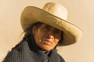 Old woman with straw hat