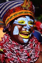 Woman of the Marowa Welda applying makeup for the annual sing-sing Festival in Goroka