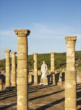 Ruins with statue of emperor Trajano