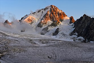 Aiguille du Chardonnet peak in fog over the glacier Glacier du Tour