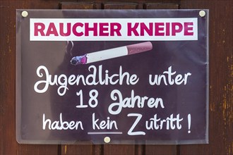 Sign for smoker pub at the entrance door