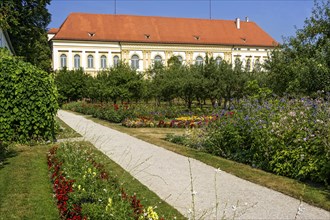 Colorful flower beds and historical orchard