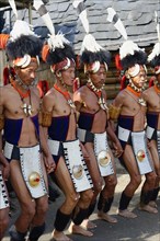 Naga tribal men in traditional clothing performing ritual dances