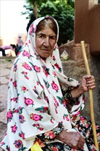 Old woman with tied chador