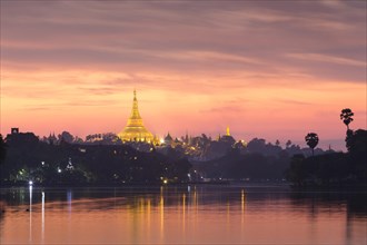 Illuminated Shwedagon Pagoda at sunset