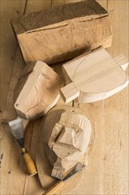 Steps from wooden block to wooden mask