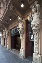Caryatids on building front
