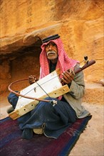 Old bedouin playing the one-string Lyra