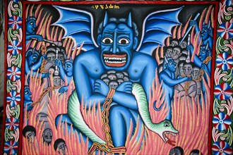 Wall painting blue coloured devil with sinner