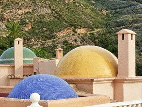 Fireplaces and multicoloured domes on one roof