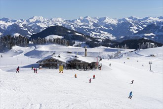 Mountain restaurant ski hut Tanzbodenalm in the ski area Wilder Kaiser Brixental in winter