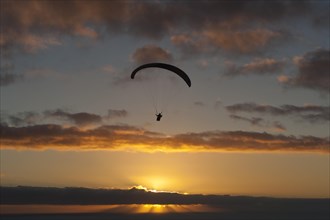 Paragliding over the Atlantic near Puerto Naos during sunset