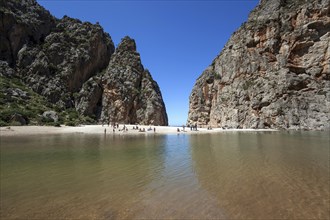 People on the beach in the gorge Torrent de Pareis