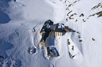 Snow-covered hospice on the Great St. Bernhard Pass