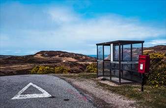 Shelter for hikers and red post box on the street