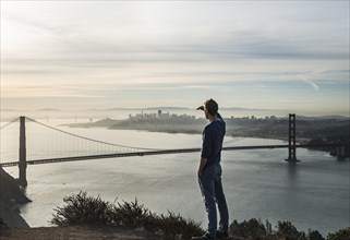 Young man looks to the Golden Gate Bridge