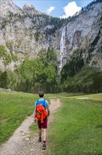 Hiker on way to Rothbach Waterfall