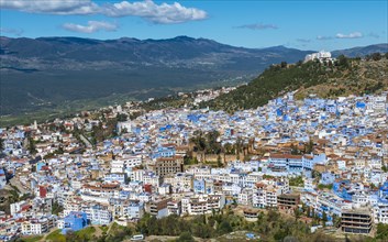 View on blue houses of the medina of Chefchaouen with Kasbah