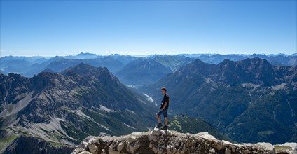 Hiker at the summit of the Hochvogel