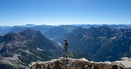 Hiker at the summit of the Hochvogel