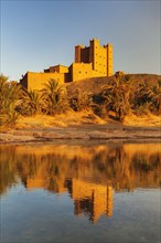 Ait Hamou ou Said Kasbah is reflected in the Draa River