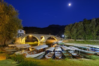 Excursion boats and Old Bridge Stari most at dusk