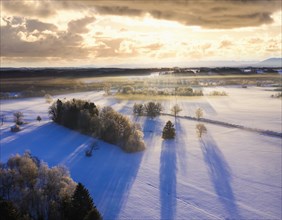 Winter landscape with hoarfrost at sunrise