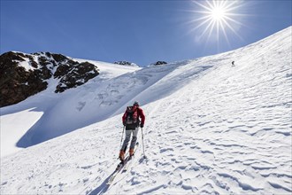 Ski tourer ascending Finailspitze in Schnals at Schnalstal Glacier