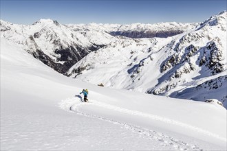 Ski tourer ascending Hintere Nonnenspitze