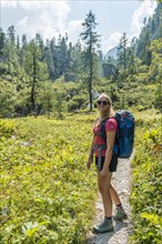 Hiker on hiking trail to Karlingerhaus