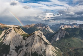 Panoramic view on mountain landscape with rainbow