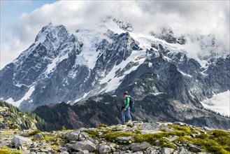 Female hiker with view of Mt. Shuksan with snow and glacier