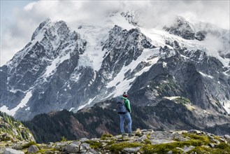 Female hiker with view of Mt. Shuksan with snow and glacier