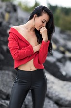 Woman with red jacket and black leggings