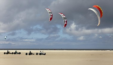 Beach sailer at the sandy beach with wind