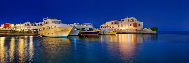 Boat harbour with dive boat at sunset