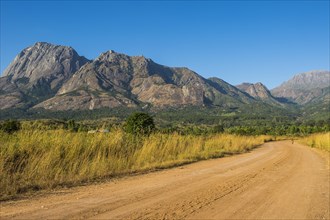 Dusty Road leading to the granite peaks of Mount Mulanje