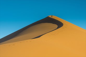 Woman on the giant sanddune Dune 45